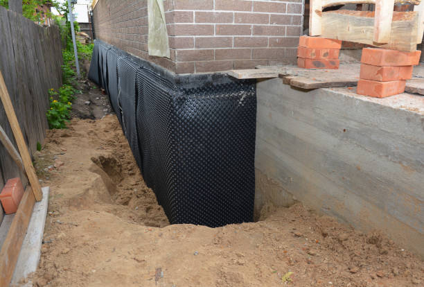 Happy homeowners after waterproofing job in Fairfax Station